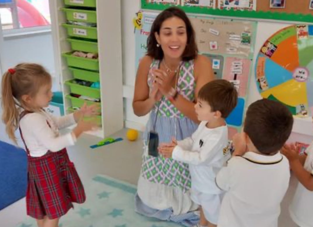 A caring teacher providing guidance to a student at St. Dominic's International School, representing the school's commitment to comprehensive pastoral support.